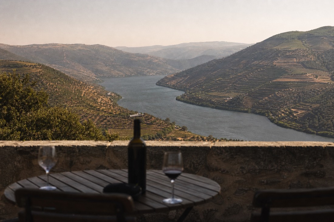 Panoramic viewpoint over a sweeping bend of the Douro with terraced hills stretching into the distance