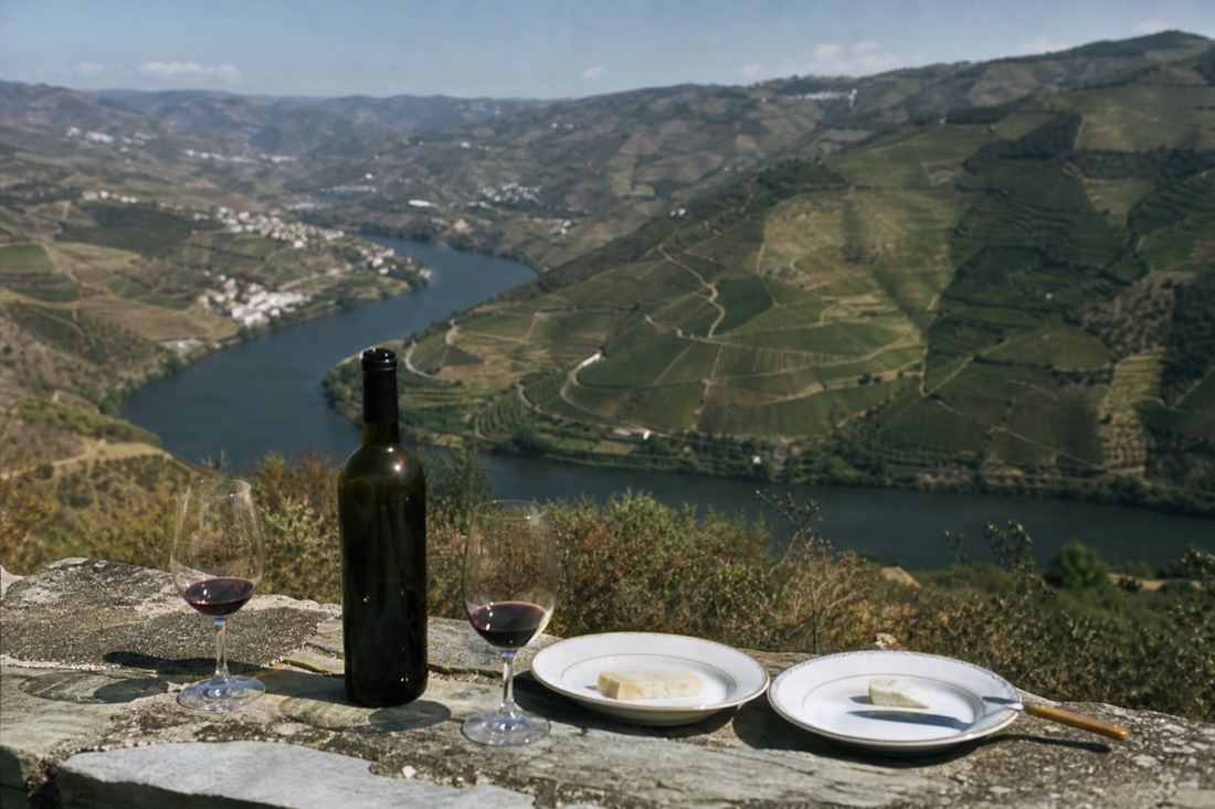 Vineyard estate on a high ridge above a wide bend of the Douro between two river towns