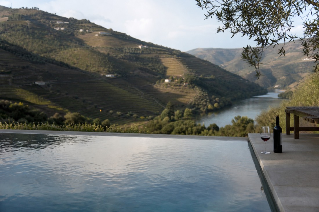Infinity-style pool terrace overlooking Douro vineyard slopes at a quiet estate