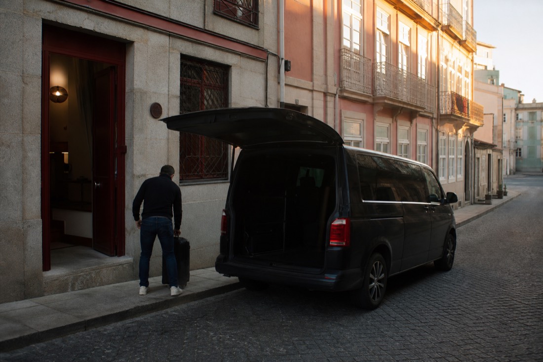 Early morning street outside a Porto guesthouse where a day tour begins with a hotel pickup